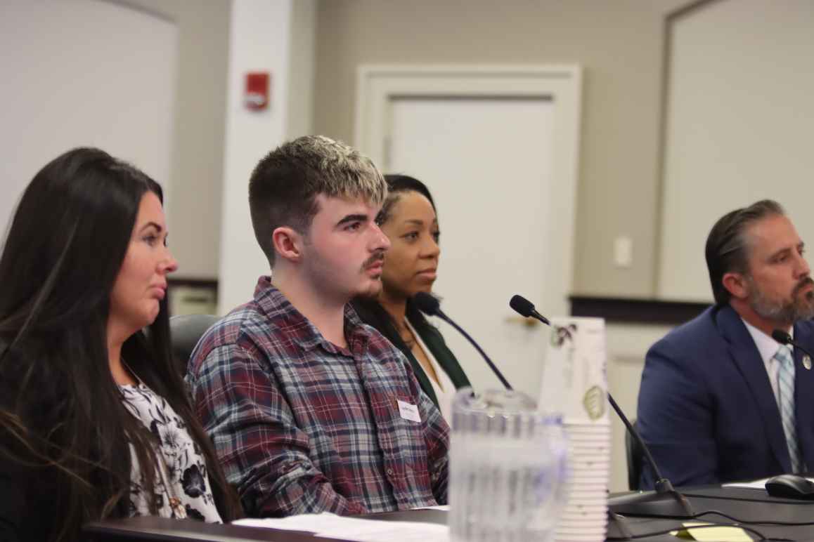 Amanda Hall and her son, Jayden Spence, testify in a Frankfort, KY committee room.