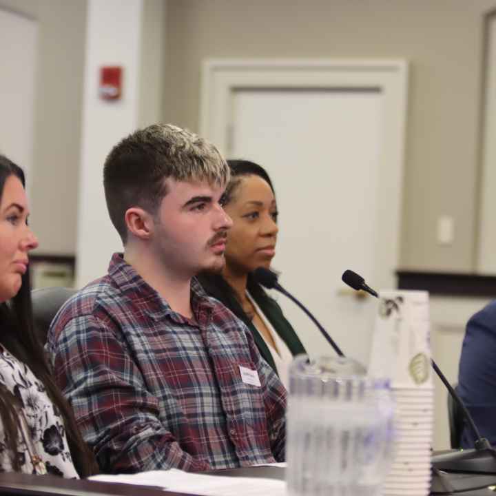 Amanda Hall and her son, Jayden Spence, testify in a Frankfort, KY committee room.